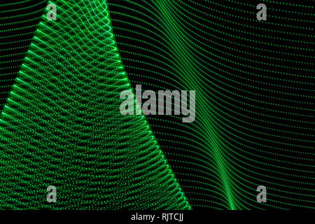 Abstract curved lines of green colors. Concept of renewable or green energy. Abstract art with lights Stock Photo