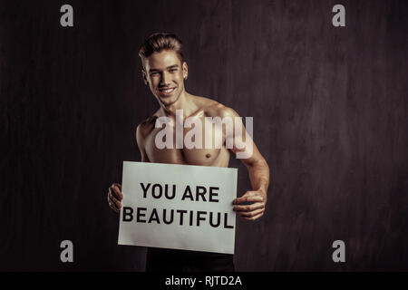 Joyful happy blonde man cheering you up Stock Photo