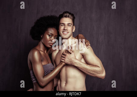 Nice handsome man holding his girlfriends hand Stock Photo