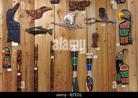 Wall display of contemporary Northwest Coast First Nations carvings artwork for sale in gift shop at the Museum of Vancouver, Vancouver, BC, Canada Stock Photo