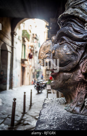 Traditional mask with face of Pulcinella in 'Spaccanapoli Streets' in the old town of Naples, Italy Stock Photo