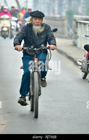 Asia, Asien, Southeast Asia, Vietnam, Northern, Hanoi, Capitol, man on bike Stock Photo