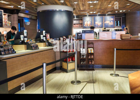 HONG KONG - JANUARY 26, 2016: interior of Starbucks cafe. Starbucks Corporation is an American global coffee company and coffeehouse chain based in Se Stock Photo