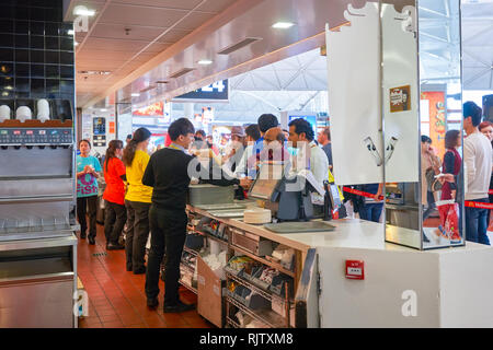 HONG KONG - MARCH 08, 2016: McDonald's restaurant in the Airport. McDonald's primarily sells hamburgers, cheeseburgers, chicken, french fries, breakfa Stock Photo