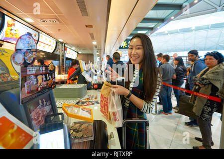 HONG KONG - MARCH 08, 2016: McDonald's restaurant in the Airport. McDonald's primarily sells hamburgers, cheeseburgers, chicken, french fries, breakfa Stock Photo