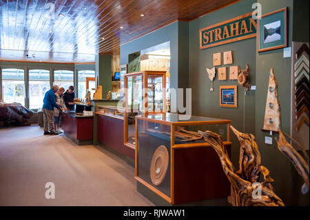 Tourists inside Wilderness Woodworks gallery, a mill specializing in Huon Pine in Strahan, Tasmania. The tree is native to south west Tasmania and hig Stock Photo