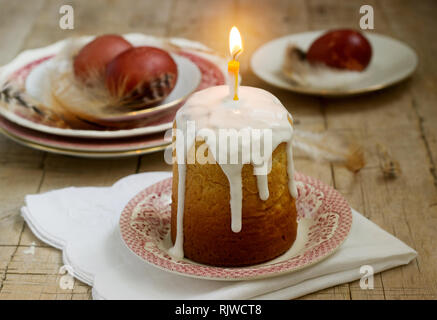 Easter composition with Easter cake and Easter eggs on a wooden background. Rustic style. Stock Photo