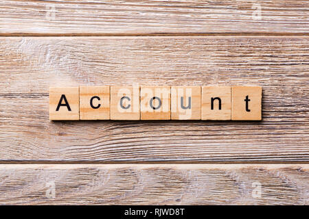 Account word written on wood block. Account text on wooden table for your desing, concept. Stock Photo