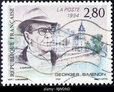 Portrait of novelist Georges Simenon on french postage stamp Stock Photo