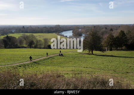 Walkers climb the hill from the river Thames floodplain and up Richmond Hill, on 3rd February 2019, in London, England. Stock Photo