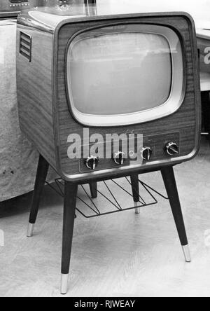 Television in the 1950s. A Luxor television set that was available for customers 1957. A typical 1950s design with a wooden case standing on thin legs. Stock Photo
