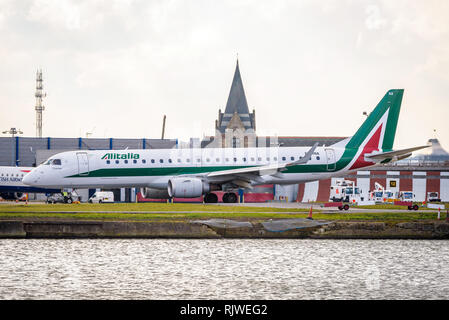 London, England. February 2018. Embraer ERJ-190STD Alitalia Cityliner EI-RNA departing from London City Airport (LCY) Stock Photo