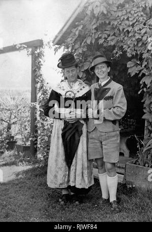 Couple, dress swap, role swap, man in women's clothing, woman in men's clothing, traditional costumes, 1930s, Bavaria, Germany Stock Photo