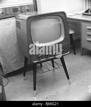 Television in the 1950s. A Luxor television set that was available for customers 1957. A typical 1950s design with a wooden case standing on thin legs. ref BV20-1 Stock Photo