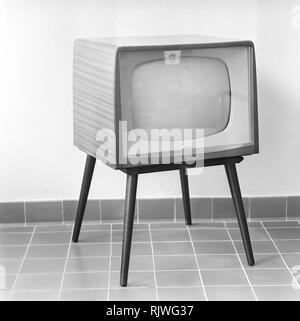Television in the 1950s. A Radiola television set that was available for customers 1957. A typical 1950s design with a wooden case standing on thin legs. ref BV20-3 Stock Photo