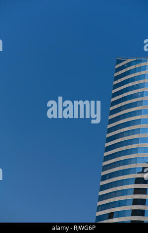 Underside angle view to textured background of modern glass blue building skyscrapers Stock Photo
