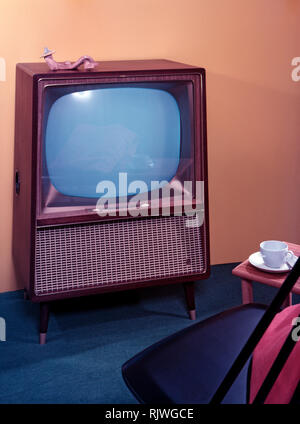 Television in the 1950s. A Grundig television set that was available for customers 1957. A typical 1950s design with a wooden case. ref BV65-4 Stock Photo