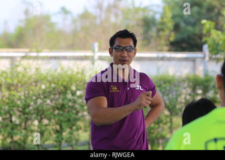 Internationally renowned Thai former tennis champion Paradorn Srichaphan coaches young students at an international school in Hua Hin. Stock Photo