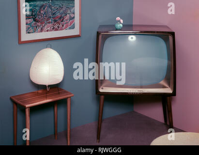 Television in the 1950s. A Grundig television set that was available for customers 1957. A typical 1950s design with a wooden case standing on thin legs. ref BV66-3 Stock Photo