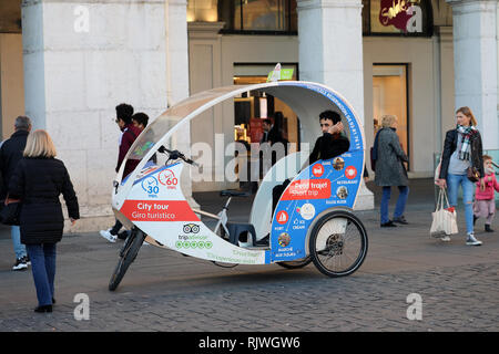 Nice, France - February 6 2019: Cycle Rickshaw Driver Waiting For Customers On Massena Square (Place Massena) In Nice, French Riviera, France, Europe Stock Photo