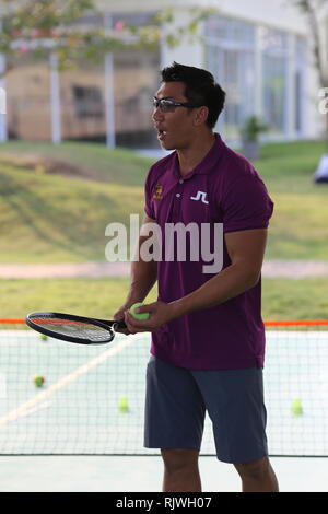 Internationally renowned Thai former tennis champion Paradorn Srichaphan coaches young students at an international school in Hua Hin. Stock Photo