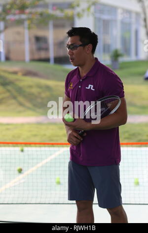 Internationally renowned Thai former tennis champion Paradorn Srichaphan coaches young students at an international school in Hua Hin. Stock Photo