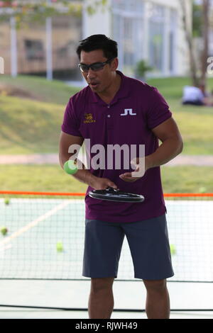 Internationally renowned Thai former tennis champion Paradorn Srichaphan coaches young students at an international school in Hua Hin. Stock Photo