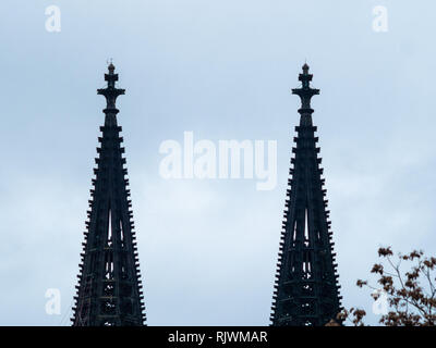 Minimalist shot of gothic Cologne Cathedral in Germany with scaffold against cloudy sky Stock Photo