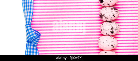 easter abstract gift card on pink and white textured background with pink easter eggs laying in row with plenty copy space for the text Stock Photo