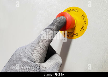 red button / finger on the red button Stock Photo