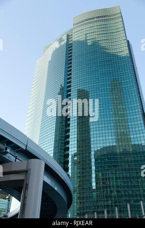 The Shiodome City Centre building next to a rail line in Tokyo, Japan Stock Photo