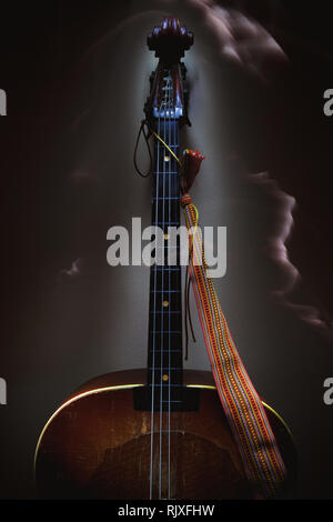 Old string instrument called Tamburica Cello from Balkans. Stock Photo