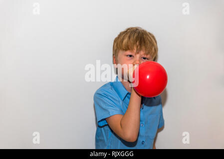 cute boy blow up balloon Stock Vector Art & Illustration, Vector Image ...