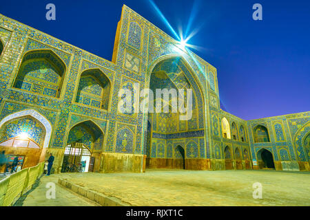 ISFAHAN, IRAN - OCTOBER 19, 2017: The large East portal (iwan) leads to the main prayer hall of Shah Mosque, on October 19 in Isfahan Stock Photo