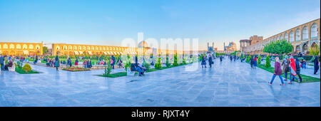 ISFAHAN, IRAN - OCTOBER 19, 2017: Panorama of Naqsh-e Jahan, the central and the biggest square in the city, and the best place to spend the evening,  Stock Photo