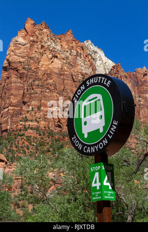 Jacob Peak, part of the Court of the Patriarchs behind a shuttle bus stop sign, Zion National Park, Springdale, Utah, United States. Stock Photo