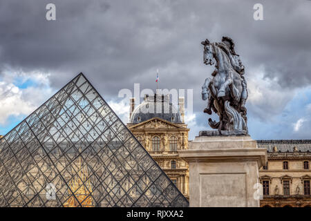 Statue of king Louis XIV in front of Louvre Palace in Paris Stock Photo