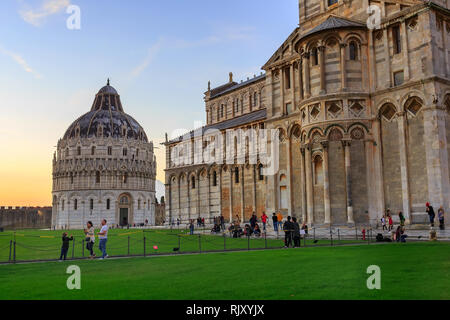 Pisa, Italy - October 25, 2018: People near Pisa Baptistery and Cathedral Stock Photo