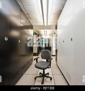 Desk chair in server room Stock Photo