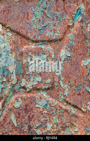 Colorful texture of a decaying old rusty gasoline canister Stock Photo