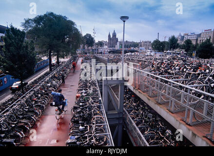 Netherlands, Amsterdam, Multi Level Bicycle Parking Garage Outside Central Station Amsterdam Stock Photo