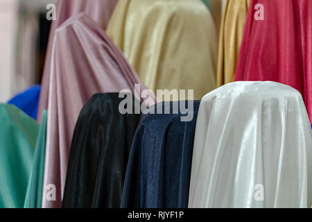 Burqa Color Varieties fabric for sale looks like burqa different colors Stock Photo - Alamy