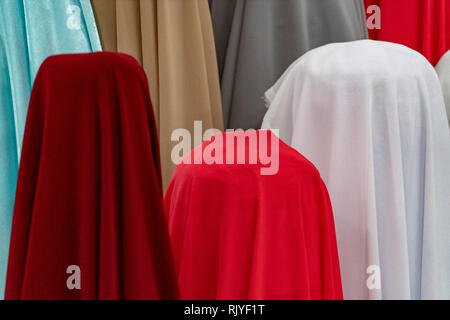 Burqa Color Varieties fabric for sale looks like burqa different colors Stock Photo - Alamy