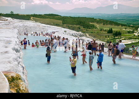 Tourists bathing in the travatine pools oand thermal waters of Pamukkale. Turkey Stock Photo