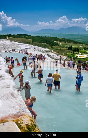 Tourists bathing in the travatine pools oand thermal waters of Pamukkale. Turkey Stock Photo