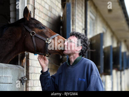 A Stable hand with a horse at John Berry Stables, Newmarket. Stock Photo