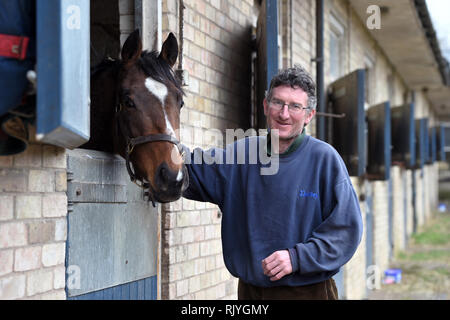 A Stable hand with a horse at John Berry Stables, Newmarket. Stock Photo