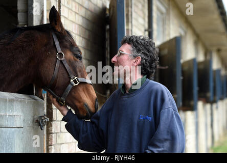 A Stable hand with a horse at John Berry Stables, Newmarket. Stock Photo