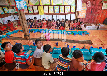 Rohingya refugee children attend class at a temporary school in ...