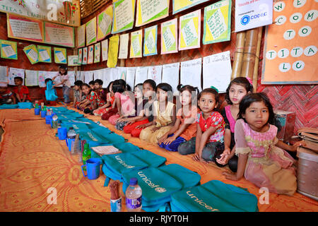 Rohingya refugee children attend class at a temporary school in ...